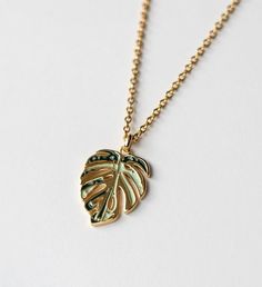 Perfect gift for the plant mom and nature enthusiast! This necklace is crafted in 18k gold plated over sterling silver. | Inspired by my very own Monstera deliciosa Albo, this gorgeous Monstera Deliciosa leaf necklace is plated in 18K Gold and has a Mirror- like finish. A perfect stunning necklace gift for nature enthusiast. | 1-800-Flowers Gifts Delivery Variegated Monstera Thai Constellation Necklace 18K Gold Sterling Silver Leaf-shaped Jewelry In Yellow Gold, Yellow Gold Leaf Shape Nature-inspired Jewelry, Leaf-shaped Yellow Gold Necklace, Yellow Gold Leaf Necklace As Gift, Yellow Gold Leaf Necklace For Gift, Leaf-shaped Yellow Gold Necklace For Gift, Nature-inspired Gold Jewelry With Birth Flower, Nature-inspired Gold Flower Pendant Jewelry, Gold Botanical Flower Pendant Jewelry