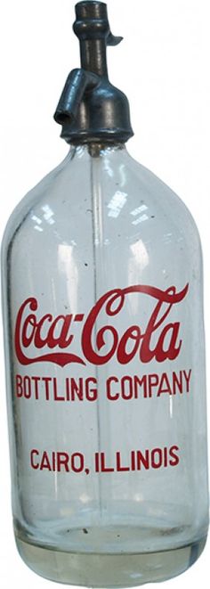 an old fashioned glass bottle with the word coca - cola on it