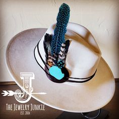 If you’re looking for the perfect accessory to complement your favorite boho style, look no further. This Boho-Style Western Felt Hat w/ Natural Feather & Turquoise Hat Accent by The Jewelry Junkie is absolutely everything that you need. Not only is it easy to incorporate into any and all outfits, but the genuine leather and natural feathers of the band immediately elevate whatever it is you’re wearing. One Size Hat with adjustable inner hat liner (see last photos) The same primary feathers will Blue Wide Brim Bohemian Felt Hat, Blue Bohemian Wide Brim Felt Hat, Bohemian Blue Wide Brim Felt Hat, White Bohemian Hat, White Bohemian Felt Hat For Rodeo, Blue Bohemian Felt Hat For Festival, Bohemian Blue Fedora With Flat Brim, Bohemian White Fedora Felt Hat, Bohemian White Felt Hat With Flat Brim