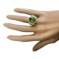 Stamped: 14K Yellow GoldTotal Ring Weight: 10.0 GramsRing Length: N/ARing Width: N/AGemstone Weight: Total Natural Peridot Weight is 6.52 Carat (Measures: 12.90x11.30 mm)Color: GreenDiamond Weight: Total Natural Diamond Weight is 1.50 Ca... Yellow Gold Diamond Ring, Gold Diamond Ring, Green Diamond, Gold Diamond Rings, Cocktail Rings, Precious Metals, Natural Diamonds, Gold Diamond, Diamond Ring