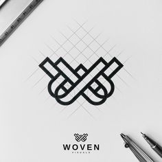 a pen and some scissors on top of a white paper with the word woven written in it