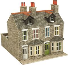 a model house with three windows and two chimneys on the top floor, in front of a white background