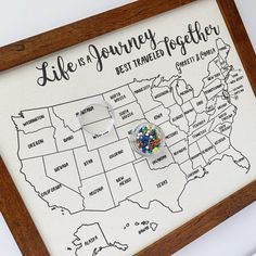 a wooden frame with a map and gummy bears in the shape of the united states