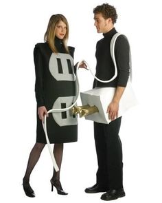 a man and woman dressed in black standing next to each other with letters on them