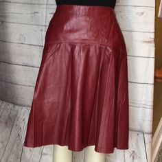 Preowned Unworn Stylist Personal Piece Vegan Leather Red A-line Bottoms For Fall, Red A-line Fitted Bottoms, Red Fitted A-line Bottoms, Red Flowy Skirt For Formal Occasions, Red Fitted Full Skirt, Formal Full Skirt In Red, Red Formal Skirt For Fall, Formal Red Flowy Skirt, Fitted Burgundy Skirt For Work