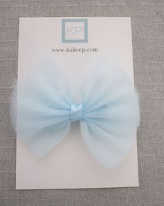 This item is FINAL SALE. No exchange or refund. Soft tulle bow hair clip for wedding, communion, birthday parties or any special events. Tulle bow is attached on grosgrain fabric bow on alligator clip.DETAILS:Colors available: Pink and BlueSize: L 5” x W 4.5”Handmade in the USA Tulle Hair Bows, Wedding Communion, Holiday Hair Bows, Tulle Bow, Tulle Bows, Bow Hair Clip, Wedding Hair Clips, Blue Tulle, Holiday Hairstyles