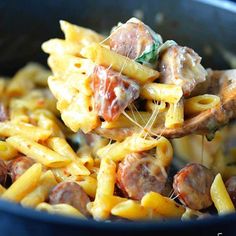 a pasta dish with meatballs and cheese sauce