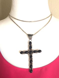 This is a gorgeous, massive, cross pendant featuring 11 black onyx stones set in sterling silver. It has very nice silver beading in between each of the onyx stones. The bail is also substantial, and can accommodate any type of chain/string. The maker's mark JP is stamped on the back side of the cross pendant. The word 'sterling' is also stamped. The sterling silver box link chain is also very substantial, it weighs ~21 grams, it is 30" in length and was made in Italy. Excellent vintage conditio Black Sterling Silver Crucifix Jewelry, Spiritual Onyx Cross Jewelry, Spiritual Black Sterling Silver Cross Necklace, Black Cross Pendant For Formal Occasions, Elegant Black Pendant Cross Necklace, Elegant Black Cross Pendant Necklace, Black Sterling Silver Cross Necklace For Gift, Elegant Black Crucifix Jewelry, Black Sterling Silver Cross Necklace