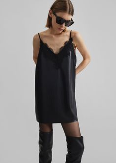 Color: Black Lightweight smooth faux leather Relaxed fit Mini length V-neckline with lace trims Adjustable spaghetti straps Slip-on style Unlined 50% Polyester 50% Polyurethane Dry Clean Imported Leather Slip Dress, December 01, Denim Suit, Paris Woman, Lace Trims, Leather Texture, Swimwear Accessories, Leather Slip Ons, Elegant Dresses