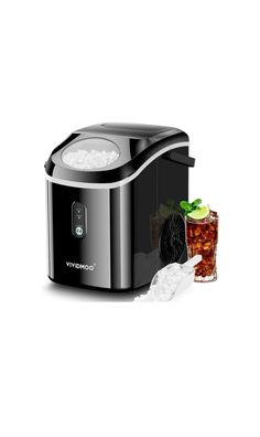 an image of a black and silver ice cream maker next to a glass of iced tea