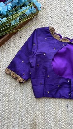 Product Description : Purple silk blouse comes with threads exclusive heavy scallop hand works for neck & sleeves and embroidery works all over the blouse as shown. Designer Cutdana Embroidered Top, Raw Silk Tops With Traditional Drape, Elegant Resham Embroidery Raw Silk Top, Elegant Raw Silk Top With Resham Embroidery, Elegant Cotton Silk Blouse Piece With Dori Work, Silk Traditional Wear With Dori Work And Long Sleeves, Elegant Fitted Embroidered Top With Traditional Drape, Fitted Tops With Intricate Embroidery In Traditional Drape, Fitted Embroidered Top With Traditional Drape