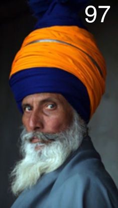 an old man with a turban on his head