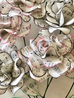 paper flowers with musical notes on them