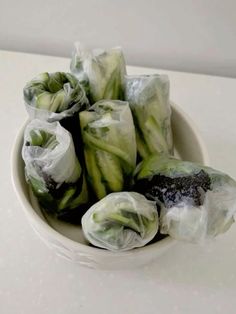 some food wrapped in plastic sitting in a bowl