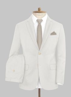 Revitalize your style with a confident touch of sophistication through our Marco Stretch Fawn Wool Suit. Crafted from a high-quality wool blend, this suit offers both comfort and elegance with its solid texture that feels exceptionally smooth on your skin. The distinct fawn-beige color brings a unique element to your outfit, elevating a classic ensemble into a contemporary statement piece that is bound to capture attention. If you're seeking to express your modern fashion sensibility with assura Tailored Beige Suit With Single Button, Single Button Linen Suits For Office, Modern Solid Color Suits For Business Casual, Modern Solid Color Business Casual Suits, White Tailored Suit With Welt Pockets, Classic Beige Suit With Concealed Placket, Classic Beige Suits With Concealed Placket, White Wool Suit For Work, Modern Solid Color Semi-formal Suits