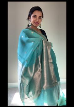 Unveiling timeless elegance: Sea green Kora Banarasi saree by #thechictale Immerse yourself in the luxurious drape of this exquisite sea green Kora Banarasi saree. Woven with intricate gold zari work, this saree is a masterpiece of Indian craftsmanship. The sea green color is perfect for any occasion, adding a touch of sophistication and grace to your look. Silk Mark certified Comes finished with Pico , fall and a blouse piece. Any Jwellery shown is NOT included but can be purchased extra by con Kora Silk Sarees, Sea Green Color, Ambience Lighting, Grace To You, Top Celebrities, Banarasi Saree, Zari Work, Banarasi Sarees, Dress Jewelry