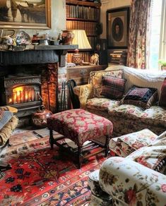 a living room filled with furniture and a fire place