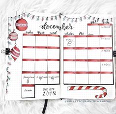 an open planner with christmas decorations on it