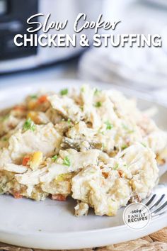 the cover of slow cooker chicken and stuffing on a plate with a fork next to it