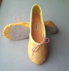 These sunny yellow ballet slippers are handmade, hand pleated & hand finished. They are made of quality soft lambskin with matching cotton lining & double layered felt inner soles. The outer full soles are of suede leather and the shoes have drawstring cords for fitting adjustment.  They are a pretty, yet durable & comfortable ballet shoe, great for dancing & dance practice, for costume or normal wear.  They can be made in the size of your choice.  If you would like these ballet slippers with a Flat Dance Shoes With Soft Sole For Spring, Spring Flat Dance Shoes With Soft Sole, Spring Dance Shoes With Soft Sole, Yellow Slippers With Rubber Sole And Round Toe, Spring Slip-on Dance Shoes With Soft Sole, Leather Slip-on Dance Shoes With Soft Sole, Carrie Bradshaw Outfits, Leather Ballet Shoes, Buttercup Yellow