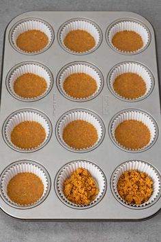 a muffin tin filled with cupcake batters and topped with an orange sauce