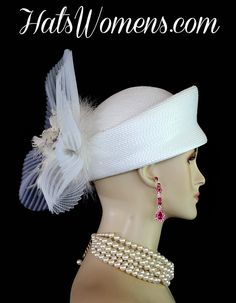 Ladies White Metallic Silver Custom Made Pillbox Designer Fashion Wedding Bridal Hat Headpiece. This Formal White Shaped Pillbox Church Hat Is Trimmed With A Large White Horsehair Crinoline Decorative Bow, Enhanced With A Handmade White Feather Flower, Accented With Metallic Silver. White Pearl Floral Appliques Are Placed Within The Center Of This Beautiful Millinery Feather Flower. This Elegant Hat Can Be Worn With The Bowing Toward The Back Of The Head Or Toward The Front Of The Face.

This Co Vintage White Wedding Costume Hats And Headpieces, White Vintage Wedding Costume Hats And Headpieces, Vintage White Hat Headpiece, White Vintage Headpiece For Formal Occasions, Vintage White Costume Hats And Headpieces For Wedding, White Vintage Headpieces For Formal Occasions, White Hat For Vintage Events, Vintage White Costume Hats For Wedding, Vintage White Formal Headpieces