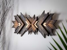 a wooden wall decoration with an arrow design