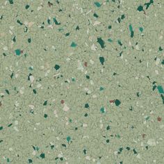 an image of a green surface that looks like it is made out of rocks and gravel