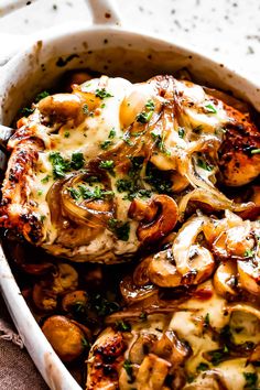 a casserole dish with mushrooms and cheese