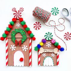 two gingerbread houses are decorated with candy canes and twine spools