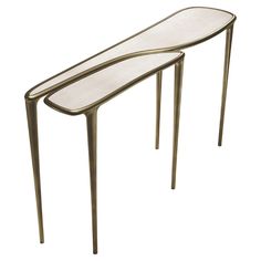 two tables made out of metal and glass, one is shaped like a curved table