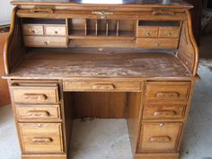 an old wooden desk with lots of drawers