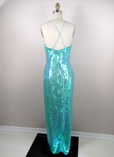 "This is a JAW-DROPPING vintage gown! It's fully embellished with iridescent sequins and in perfect condition! Measurements: Bust - 34\" Waist - 27\" Hips - 36\" Length - 59\" This item comes from a pet-free and smoke-free home. If you would like more info or have any questions, please don't hesitate to ask!" Embellished Mermaid Gown For Prom Season, Embellished Mermaid Evening Dress With Fitted Bodice, Sequin Mermaid Silhouette Prom Dress, Mermaid Sequin Dress For Wedding And Prom, Prom Sequin Mermaid Evening Dress, Prom Evening Dress With Sequins In Mermaid Silhouette, Embellished Mermaid Gown For Gala, Glamorous Green Sequined Mermaid Dress, Glamorous Green Mermaid Dress With Sequins