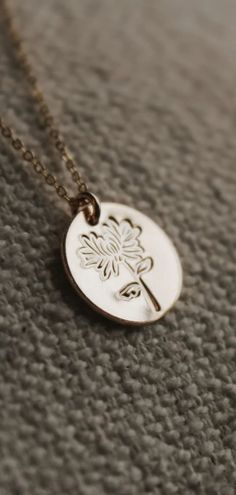 If you're looking for a unique and personalized gift for your November birthday, then this Chrysanthemum flower necklace is the perfect choice! The gold or sterling silver charm is hand-stamped with a Chrysanthemum flower design. It's the perfect way to celebrate your special someone's November birthday. Visit everaster.com to see this Chrysanthemum flower necklace and more birth flower by month jewelry. Spiritual Everyday Jewelry With Birth Flower, Everyday Spiritual Jewelry With Birth Flower, Spiritual Yellow Gold Birth Flower Jewelry, Spiritual Yellow Gold Jewelry With Birth Flower, Spiritual Birth Flower Pendant Jewelry, Everyday 14k Gold Filled Flower Jewelry, Everyday Gold Flower Necklace, Spiritual Flower Engraved Necklace, Gold Flower Jewelry For Meditation