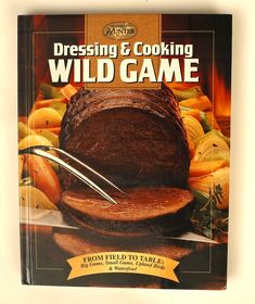 a cookbook on cooking wild game is shown