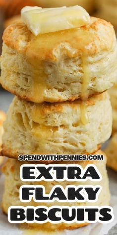 three biscuits stacked on top of each other with the words extra flaky biscuits