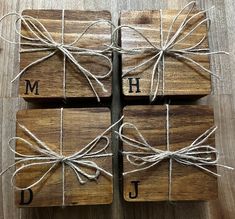 four wooden coasters tied up with twine and monogrammed letters on them