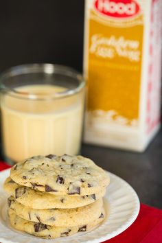 chocolate chip cookies on a plate next to a glass of milk