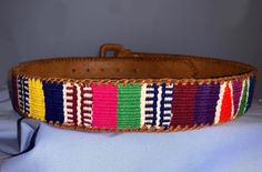 ~ This artisanal adult's leather belt is ideal for adding a splash of color to your outfits yet keeping it stylish! ~ Adult leather belt with handwoven fabric made by Guatemalan artists! ~ All of the profits from this sale go to organizations like Cojolya Association that give back to the Maya women by providing them medical care! Artisan Multicolor Fabric Belt, Adjustable Artisan Multicolor Belt, Adjustable Handmade Multicolor Belt, Multicolor Embroidered Leather Belt, Adjustable Multicolor Leather Belts, Casual Multicolor Fabric Belt, Embroidered Leather, Handwoven Fabric, Suspender Belt