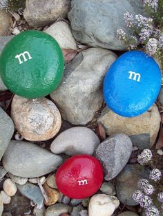 three rocks with the letter m and m painted on them