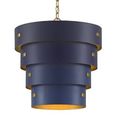 a blue and yellow light fixture hanging from a chain on a white background with gold studs