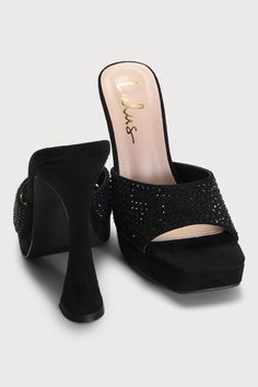 Shine brighter than any disco ball on the dance floor with the Lulus Karelee Black Suede Rhinestone Platform High Heel Sandals! The trendy slide-on silhouette has a soft faux suede composition, that shapes a square toe bed (atop a 0.75"" toe platform) and a wide, rhinestone-adorned toe strap with a curved collar. A towering pyramid heel completes the glitz and glam look! 5" wrapped pyramid heel. Cushioned insole. Felted rubber sole has nonskid markings. Man made materials. Imported. Lulus | Kare Glamorous Synthetic Sandals For Night Out, Sparkling Synthetic Sandals For Night Out, Sequin Heels For Night Out, Evening Sandals With Bling, Synthetic Material, Evening Sandals With Bling In Synthetic Material, Black Sandals For Party Season Night Out, Evening Synthetic Sandals With Bling, Synthetic Heels With Rhinestones For Party Season, Evening Bling Synthetic Sandals