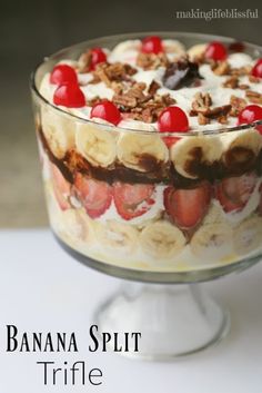 a banana split trifle dessert in a glass dish