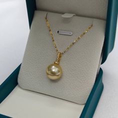 12mm Golden South Sea Pearl &Seren Pendant NecklaceAdorn yourself with opulence with our 11-12mm Golden South Sea Pearl Pendant. This exquisite jewelry piece features a lustrous golden pearl suspended in timeless elegance. Crafted with precision, the pendant exudes luxury and sophistication, making it a perfect accessory for any special occasion. Elevate your style with this radiant and rare treasure. Material: 18k pure gold with Golden South Sea Pearl, cubic zirconia and 18k gold chain necklace Golden Pearl, Golden South Sea Pearls, 18k Gold Chain, Pearl Necklaces, Sea Pearl, Necklaces Jewelry, South Seas, South Sea Pearls, Pearl Types