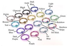 an assortment of different colored metal rings with names on each side and labeled in the upper right corner