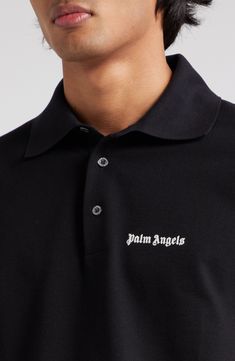 The Milanese label's gothic logo is embroidered at the chest of this classic polo made from soft, breathable cotton. 28" length (size Medium) Button half-placket Spread collar Short sleeves 100% cotton with 100% polyester embroidery Dry clean or machine wash, dry flat Made in Italy Designer Clothing Designer Black Polo Shirt With Collared Neckline, Black Designer Polo Shirt With Collared Neckline, Designer Black Polo Shirt With Ribbed Collar, Designer Collared Polo Shirt With Logo, Black Cotton Polo Shirt With Embroidered Logo, Classic Collared Polo Shirt With Logo, Classic Black Top With Logo Patch, Classic Top With Embroidered Logo And Collared Neckline, Classic Top With Collared Neckline And Embroidered Logo