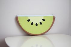 Add a splash of fun to your accessories with our cute kiwi zipper pouch! This adorable and vibrant pouch is perfect for storing your small essentials in style. Whether you're heading to school, work, or a casual outing, this kiwi-themed pouch is sure to bring a smile to your face. Key Features: Charming Kiwi Design: Features a delightful kiwi fruit design that adds a playful touch to your daily essentials. High-Quality Material: Made from durable and lightweight fabric that ensures long-lasting use. Convenient Zipper Closure: Easy-to-use zipper closure keeps your items secure and easily accessible. Compact and Portable: Perfect size to fit in your handbag, backpack, or tote, making it ideal for on-the-go use. Versatile Storage: Great for holding coins, keys, makeup, stationery, and other s Kiwi Design, Kiwi Fruit, Fruit Design, Coin Purses, Purse Pouch, Daily Essentials, Handbag Backpack, School Work, Kiwi