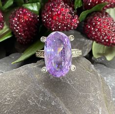 A stunning sterling silver ring packed with sparkling cubic zirconia The centre lilac stone has four claws tipped with Cubic Zirconia and the stones follow around the setting and down the shoulders  Finger size Q or 8 1/4 US. Full hallmarks for sterling silver . London In excellent condition  Will arrive gift boxed Luxury Purple Crystal Ring With Accent Stones, Dazzling Cubic Zirconia Gemstones With Accent Stones, Dazzling Amethyst Ring With Center Stone As Gift, Lavender Diamond Oval Ring, Lavender Oval Diamond Ring, Lavender Brilliant Cut Rings For Formal Events, Lavender Cubic Zirconia Rings For Gift, Formal Lavender Amethyst Ring With Cubic Zirconia, Oval Amethyst Ring With Cubic Zirconia In Prong Setting