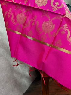 Beautiful Hot Pink Color Dupatta with Floral Jaal design Perfect Gift !! Very Light Weight Note - Dupatta has red tassels at the end. Item: DupattaBase color : Hot PinkFabric : Silk (Not Pure Silk)Work : Zari Weaved with tasselsLength of the Dupatta : 88 inches approx.Width of the dupatta : 35 inches (Approx.)Store Policies- No return or exchange will be accepted for color variations.- No return or exchange will be accepted if the color does not match your other clothing or your partners or anyo Cheap Zari Work Dupatta For Puja, Luxury Dupatta With Printed Border For Traditional Ceremonies, Luxury Dola Silk Dupatta With Border, Luxury Zari Weaving Dupatta For Festivals, Luxury Slub Silk Dupatta With Printed Border, Luxury Bollywood Handloom Dupatta, Luxury Ceremonial Slub Silk Dupatta, Luxury Handloom Dupatta For Ceremonial Occasions, Luxury Gold Dupatta With Zari Weaving