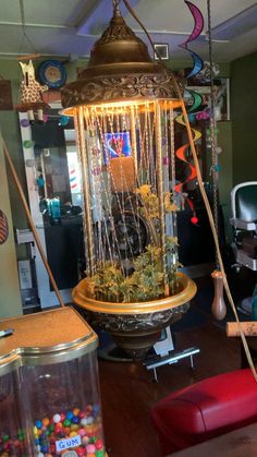 a room filled with lots of different types of decorations and items on the table in front of it